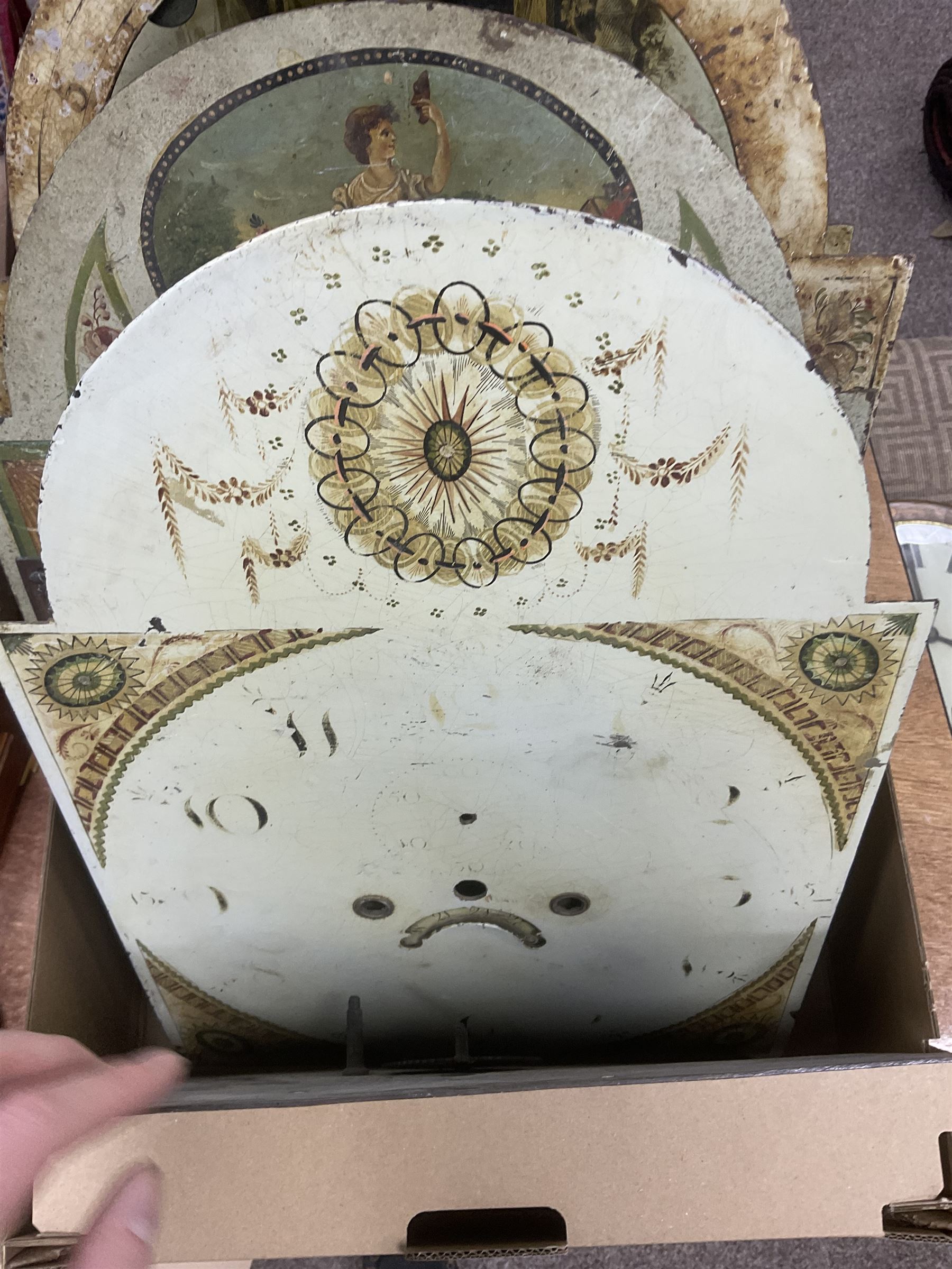 Approximately thirteen longcase clock faces, mainly 18th and 19th century, including brass and painted dials