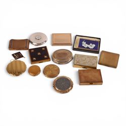 Collection of vintage powder compacts, including musical, Stratton Christian Dior, and Kigu examples