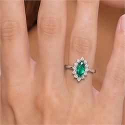 18ct white gold emerald and diamond cluster ring, single marquise cut emerald 0.25 carat, surrounded by twelve round brilliant cut diamonds, London 1979, total diamond weight approx 0.25 carat