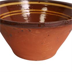 19th century terracotta bread pancheon, of circular form, the glazed interior with slip decoration, H21cm, D43cm