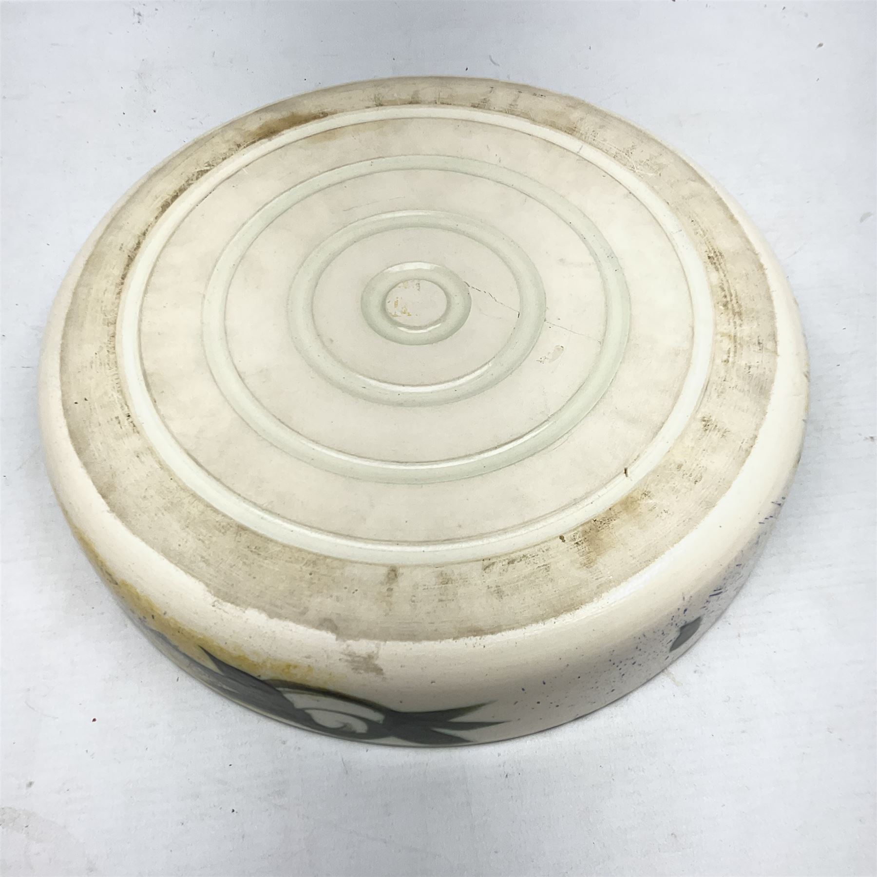 20th century Celtic Pottery, Newlyn, table lamp of tapering form, cylindrical vase and shallow bowl, all decorated with a dark stylised phoenix, modelled with wings outstretched upon sponged ochre, blue and cream ground, bowl D26cm