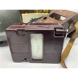 Bakelite cased Megger Insulation tester, by Evershed and Vignoles Ltd, Acton Lane Works, Chiswick, London W4, RW Munro Ltd air speed knots gauge, American green army helmet, The War Illustrated, WW2 aircraft photographic postcards, etc