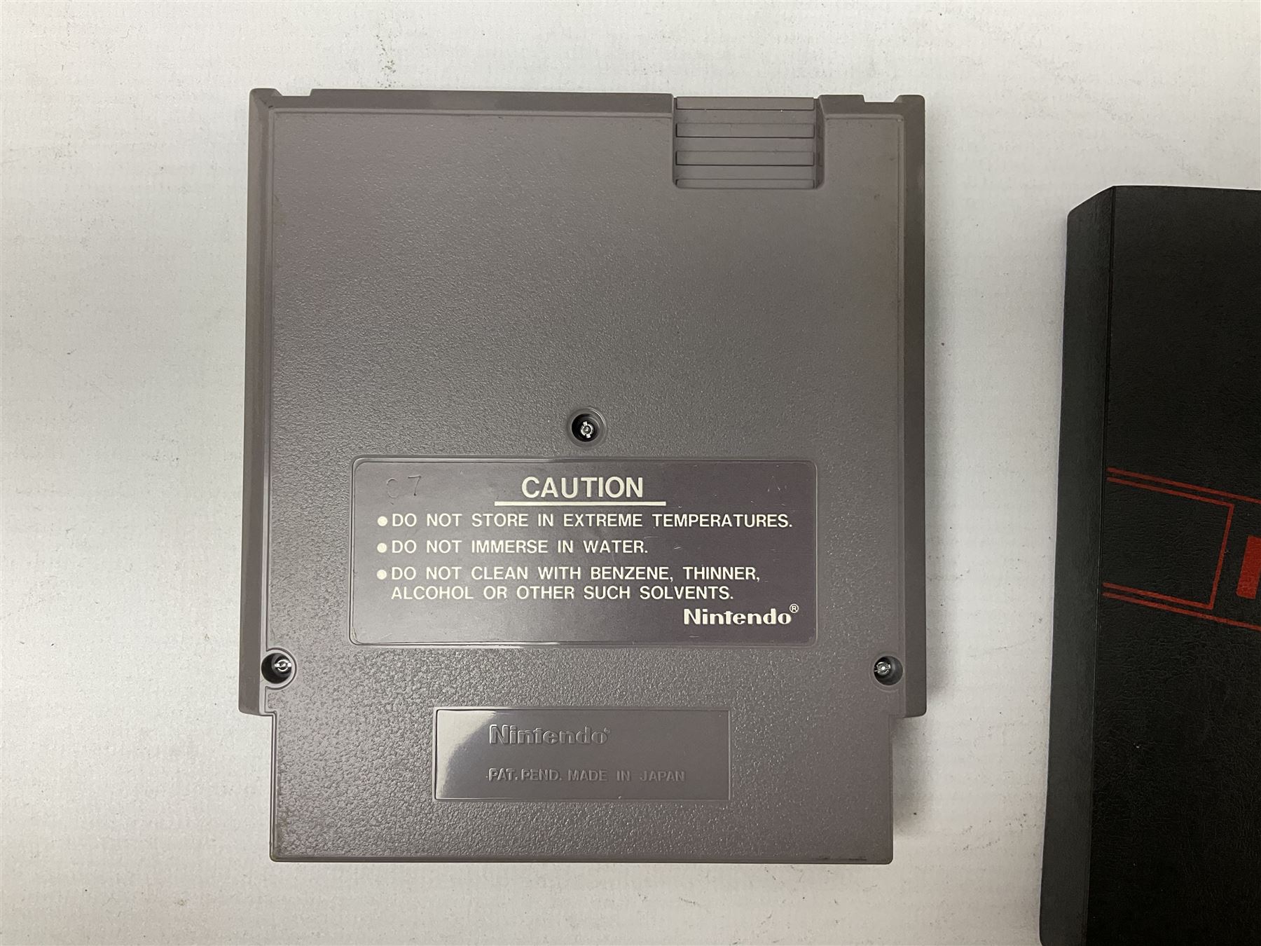 Nintendo Entertainment System (1985) console with two controllers, accessories and instruction booklet. NES Games ‘Duck Hunt’ with Nintendo Zapper gun, ‘Pinball’ and ‘Super Mario Bros.’, all with original sleeves and instruction booklets. NES game ‘Super Mario Bros. 2’ cartridge only