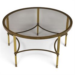 Regency style brass and glass circular table, smoked glass top mounted to a brass frame with fluted supports united by stretchers