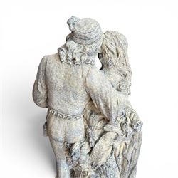 Composite garden statue group of Romeo and Juliet embracing, the couple adorned in Medieval dress standing on a naturalistic base with fallen flowers, raised on a Neoclassical fluted pedestal with Anthemion leaf motifs