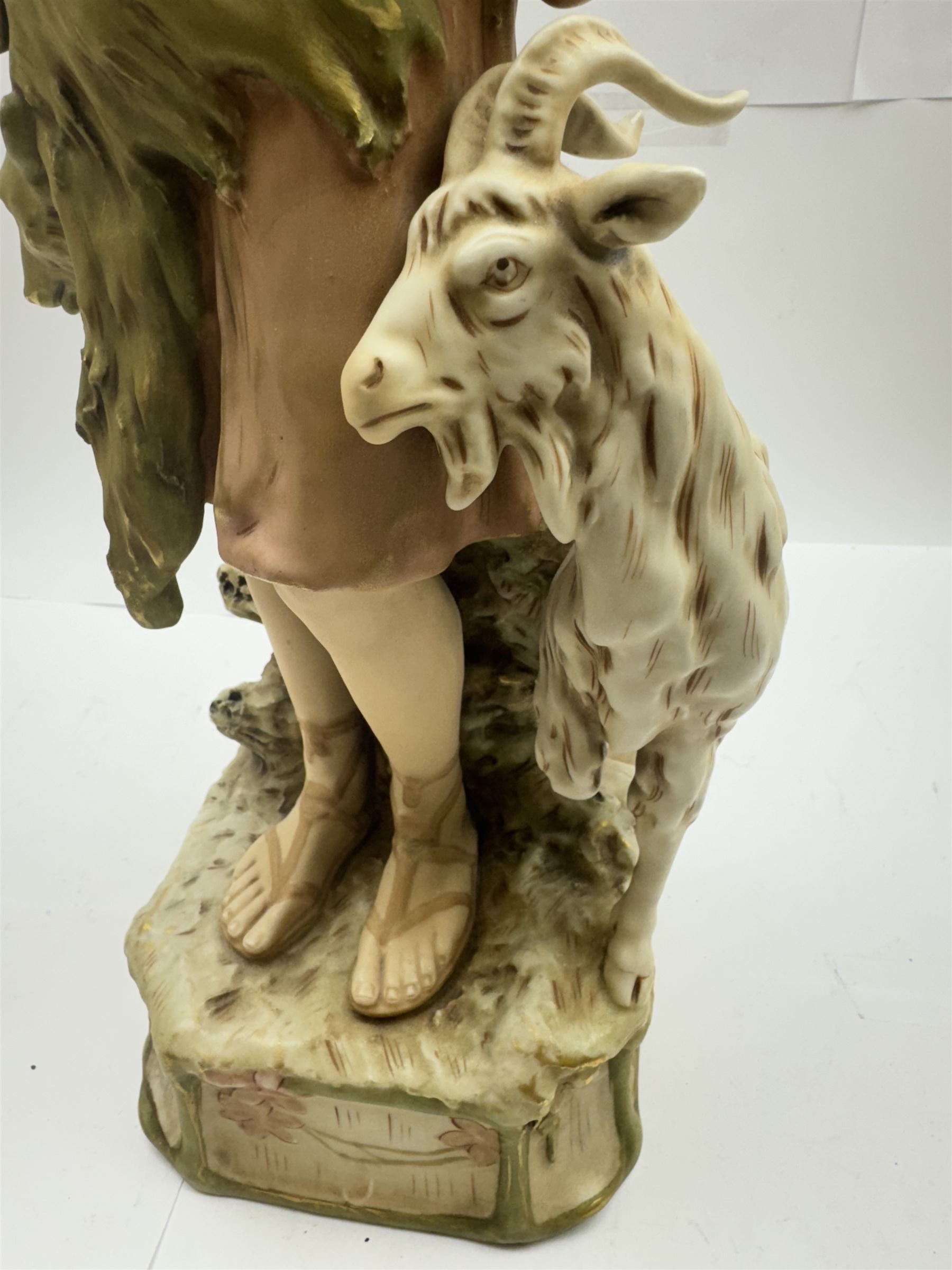 Pair of Royal Dux figures, no. 1115, modelled as a shepherd with a goat by his side and a shepherdess feeding a lamb, each wearing flowing green and pink robes with gilt detailing, with pink triangle mark beneath, H51cm