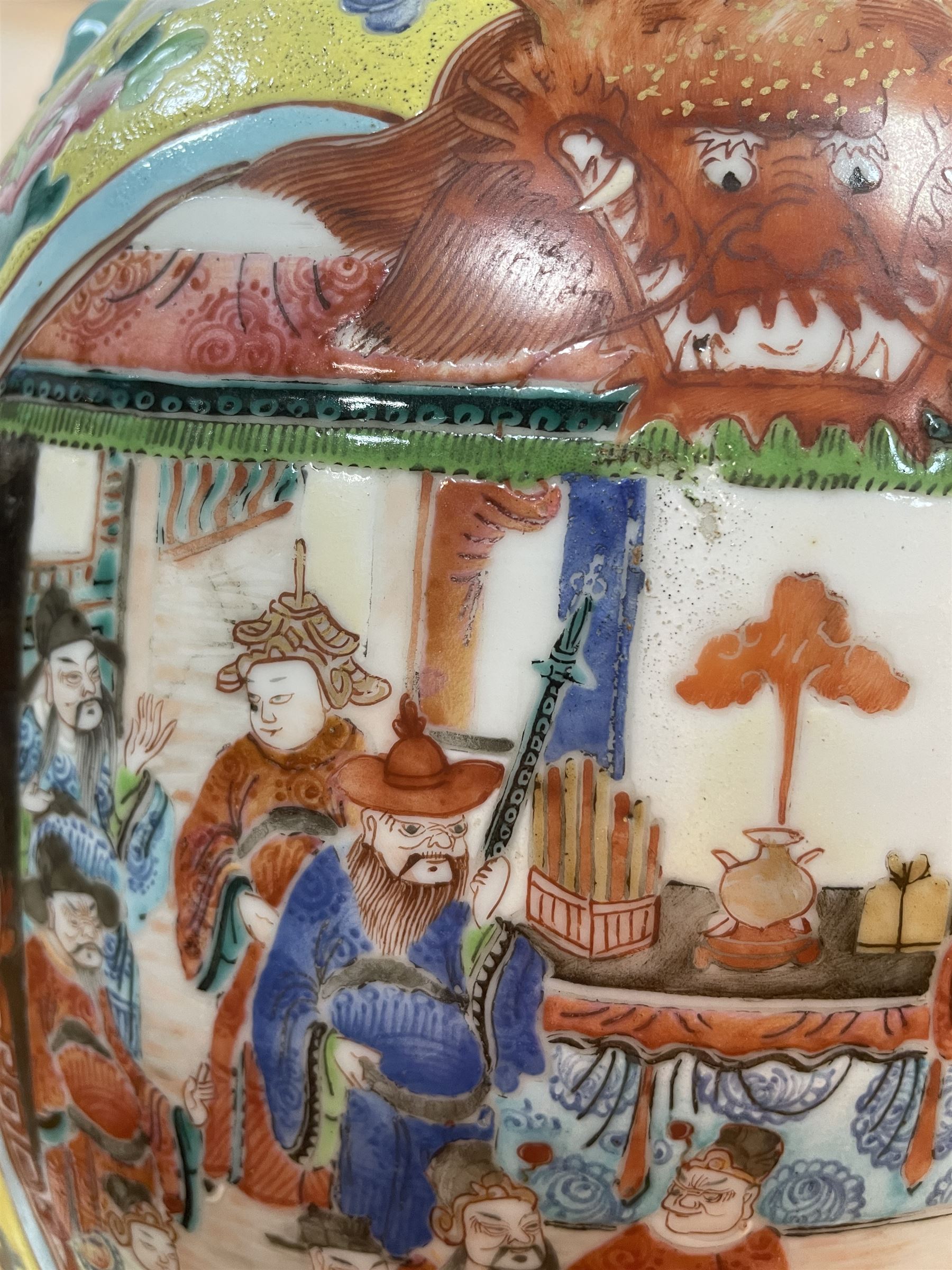 19th century Chinese famille rose yellow ground porcelain vase, of baluster form with twin applied mask ring handles, the body decorated with two shaped reserves mounted with dragon heads, depicting warriors at battle and at court, the neck with two smaller conforming figural reserves, upon a yellow ground decorated with exotic birds amidst scrolling blossom, H45.cm