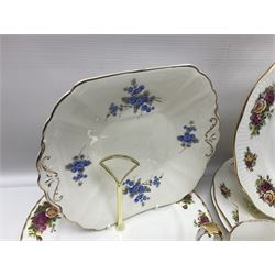 Royal albert Country Rose tea set for six, comprising teacups, saucers, dessert plates, cake plate, covered sucrier and milk jug, together with another tea set  