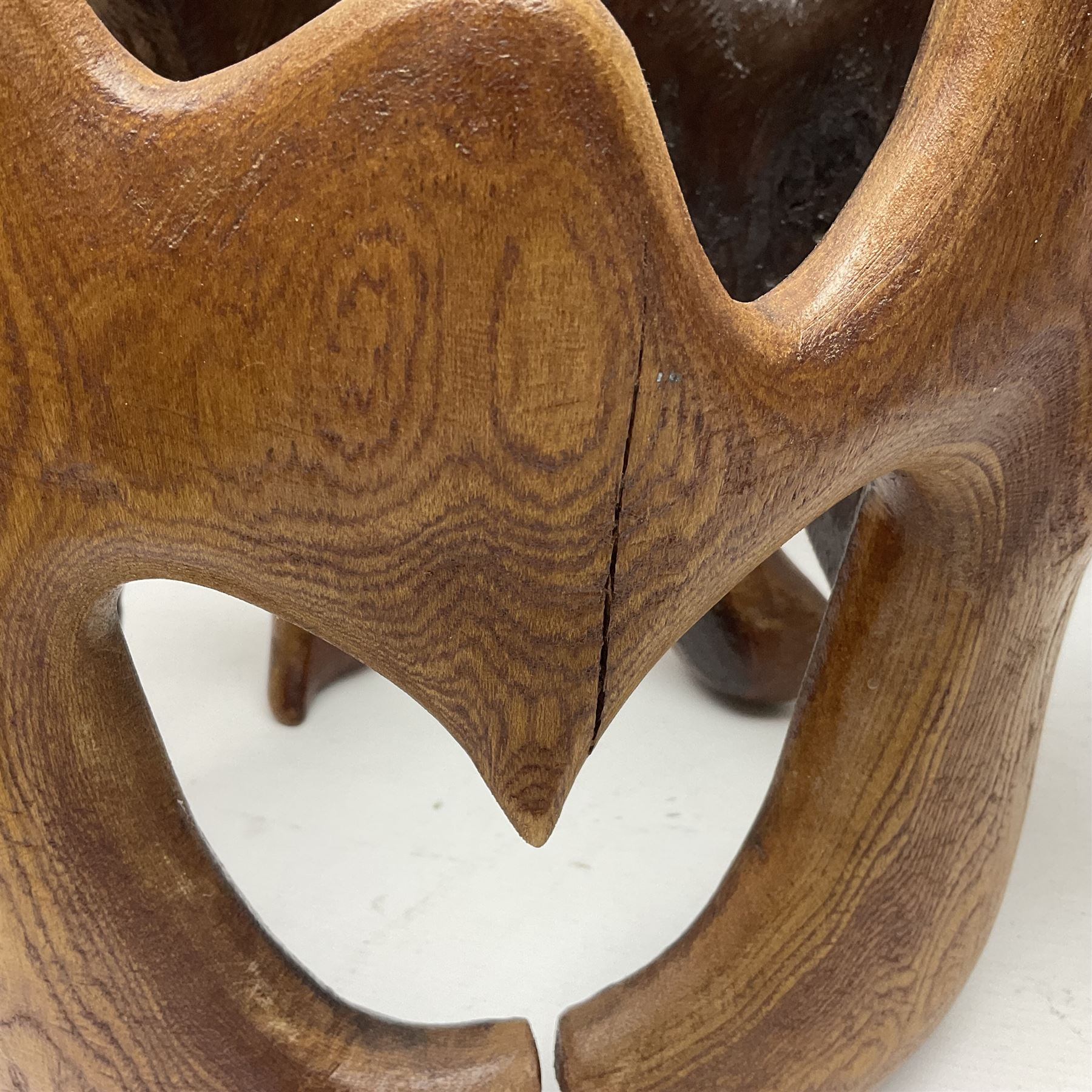 Helen Skelton (British 1933 – 2023): Two carved wooden abstract sculptures, one modelled as a entwined knot, largest H48cm. Born into an RAF family in 1933 in Kent and travelled the world extensively during her childhood. After settling in Bridlington, Helen immersed herself in painting, textiles, and wood sculpture, often inspired by nature's beauty. Her talent was showcased in a one-woman show at Sewerby Hall and recognised with the sculpture prize at Ferens Art Gallery in 2000. Sadly, Helen’s daughter passed away from cancer in 2005. This loss inspired Helen to donate her sculptures to Marie Curie upon her passing in 2023.