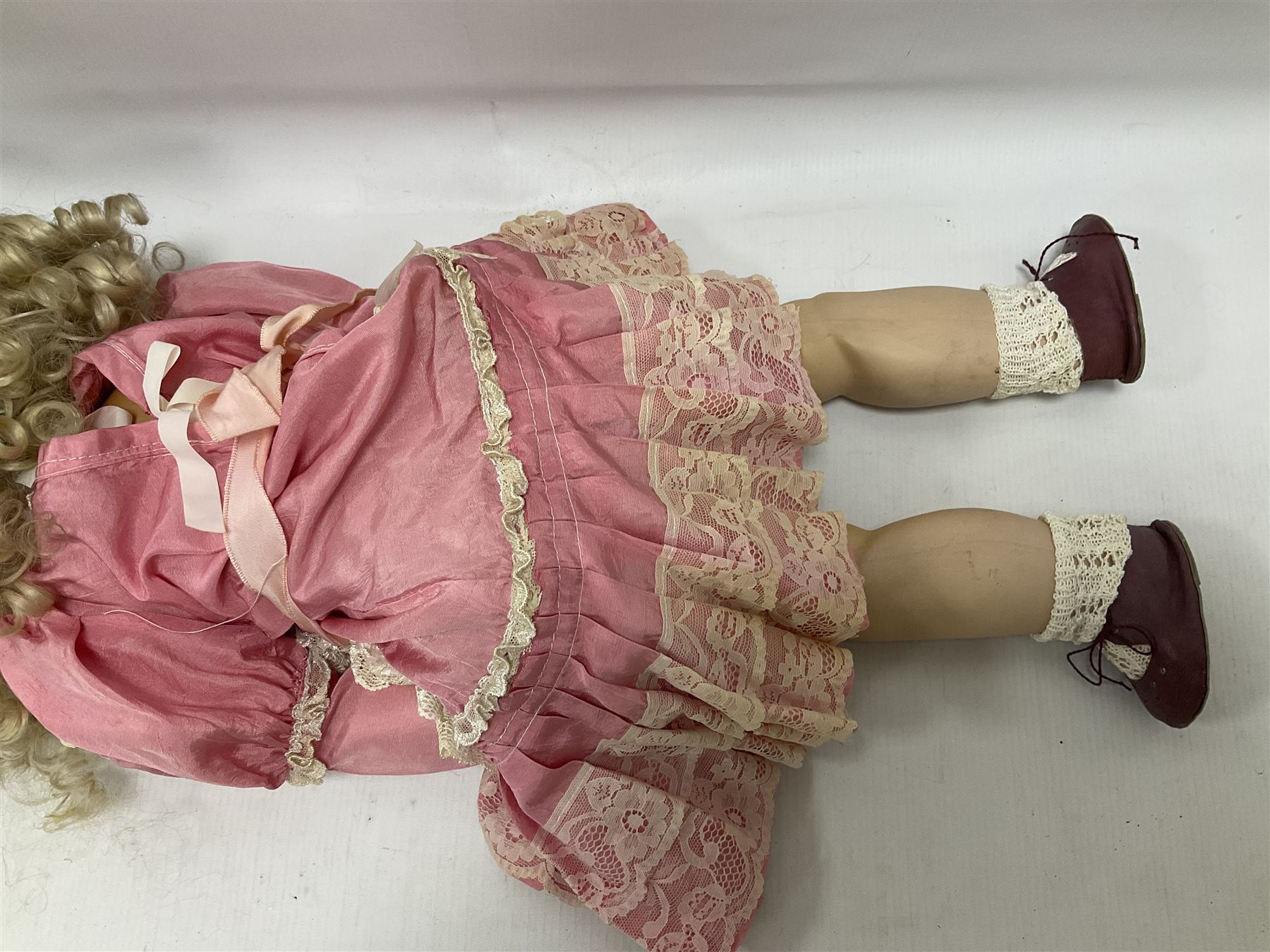 Reproduction Simon & Halbig bisque head doll with applied hair and jointed limbs; marked Simon & Halbig 117, H58cm