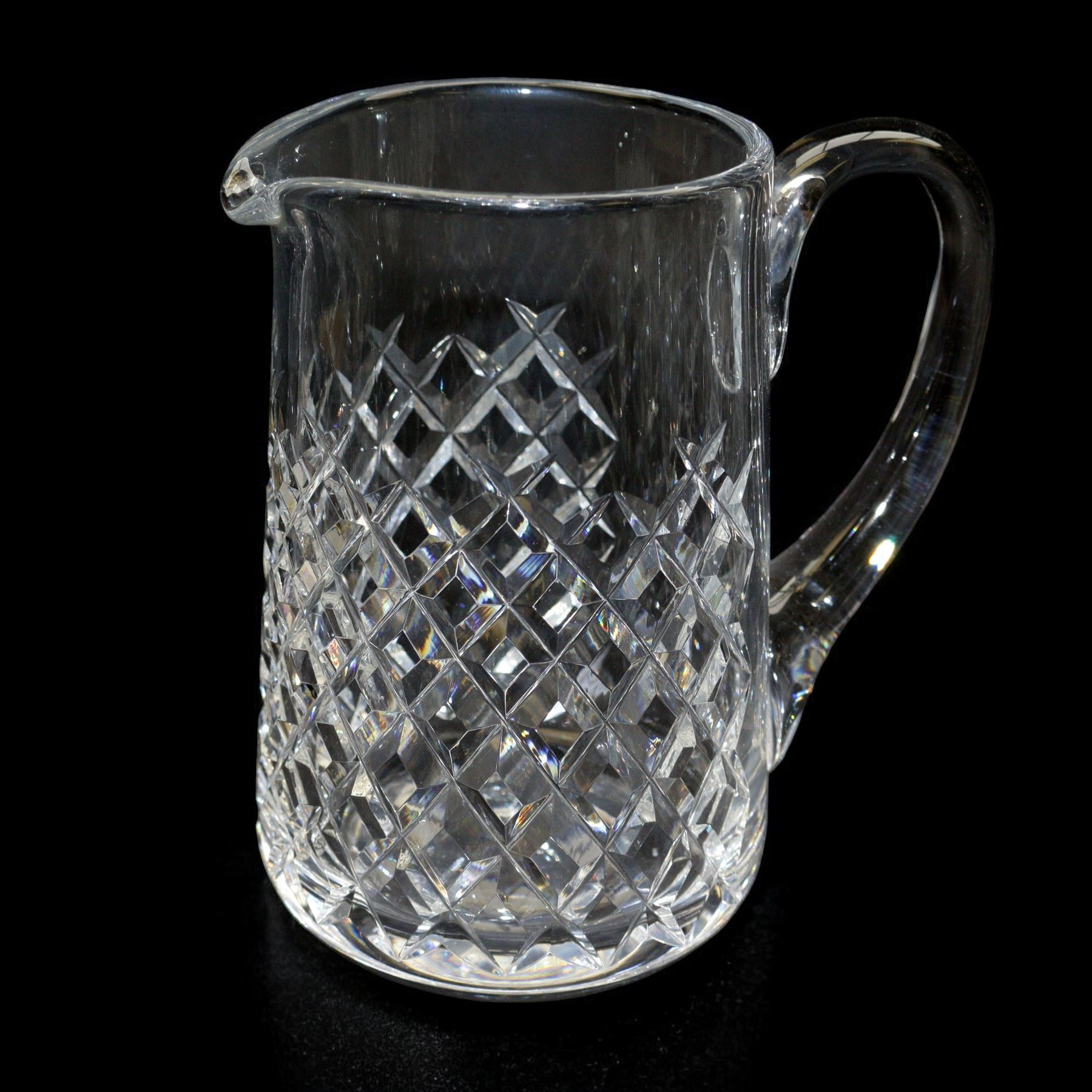 Waterford crystal Alana pattern glassware, comprising water jug, two tall tumblers, six port glasses and six sherry glasses, together with a single candle holder, jug H17cm