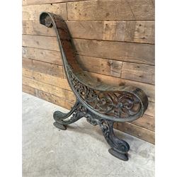 Early 20th century heavy cast iron three piece bench ends, decorated with scrolls and floral swags