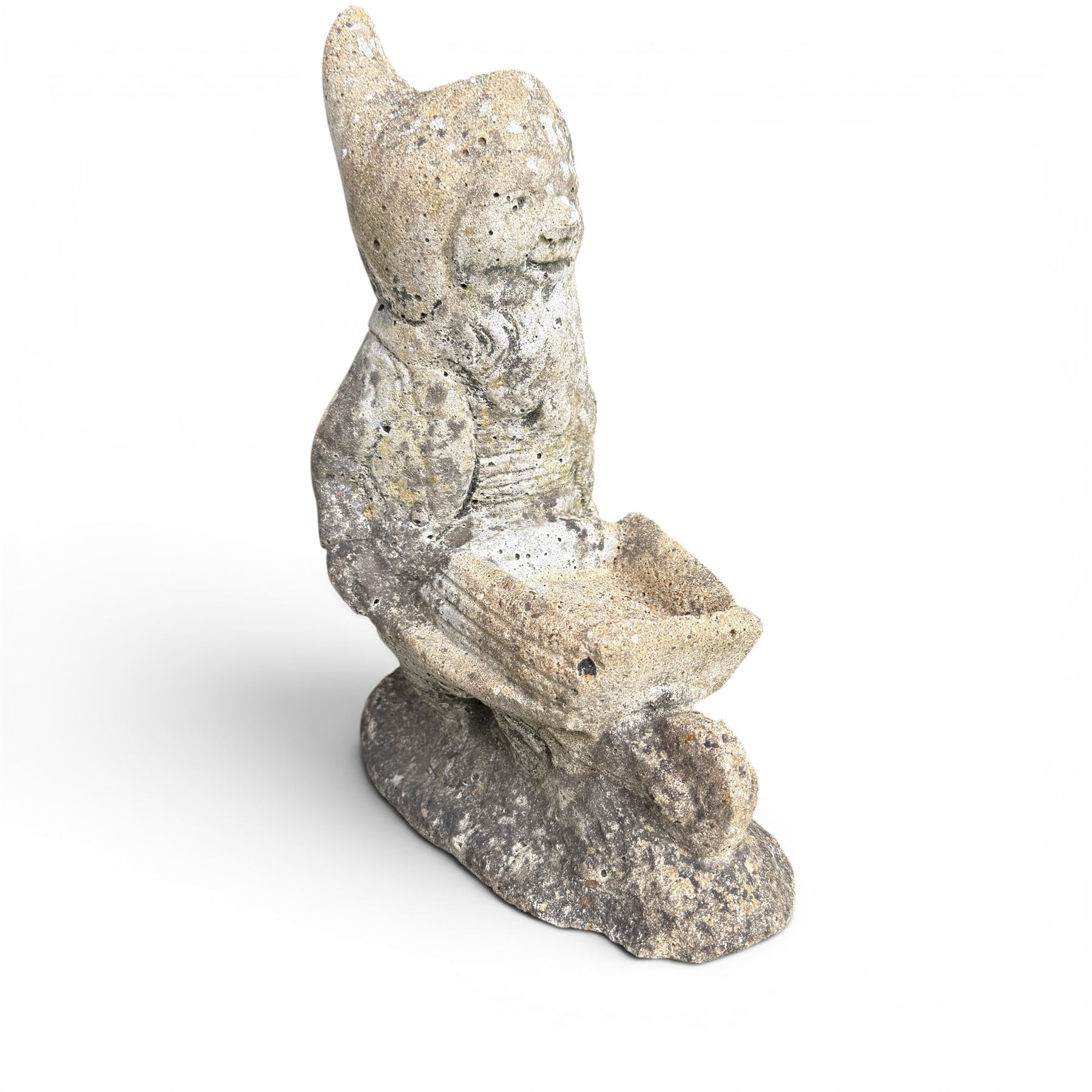Two seated cast stone garden gnomes