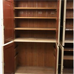 Large Georgian painted pine housekeepers cupboard, projecting cornice with four sets of twin cupboard doors with shelving enclosed