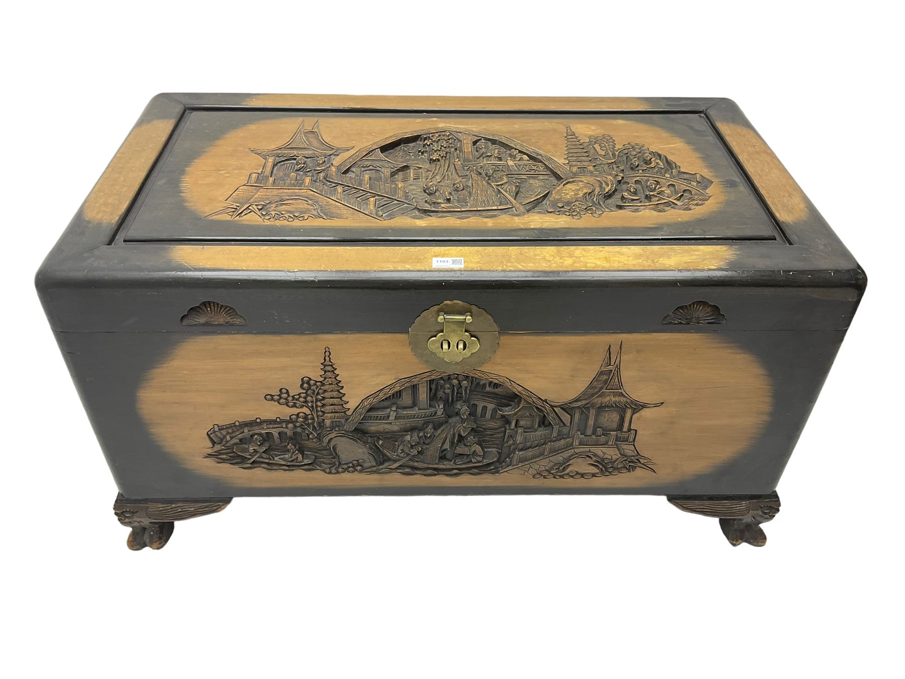 Singapore camphor wood blanket chest, rectangular hinged top with carved panel depicting traditional pagoda and river scenes