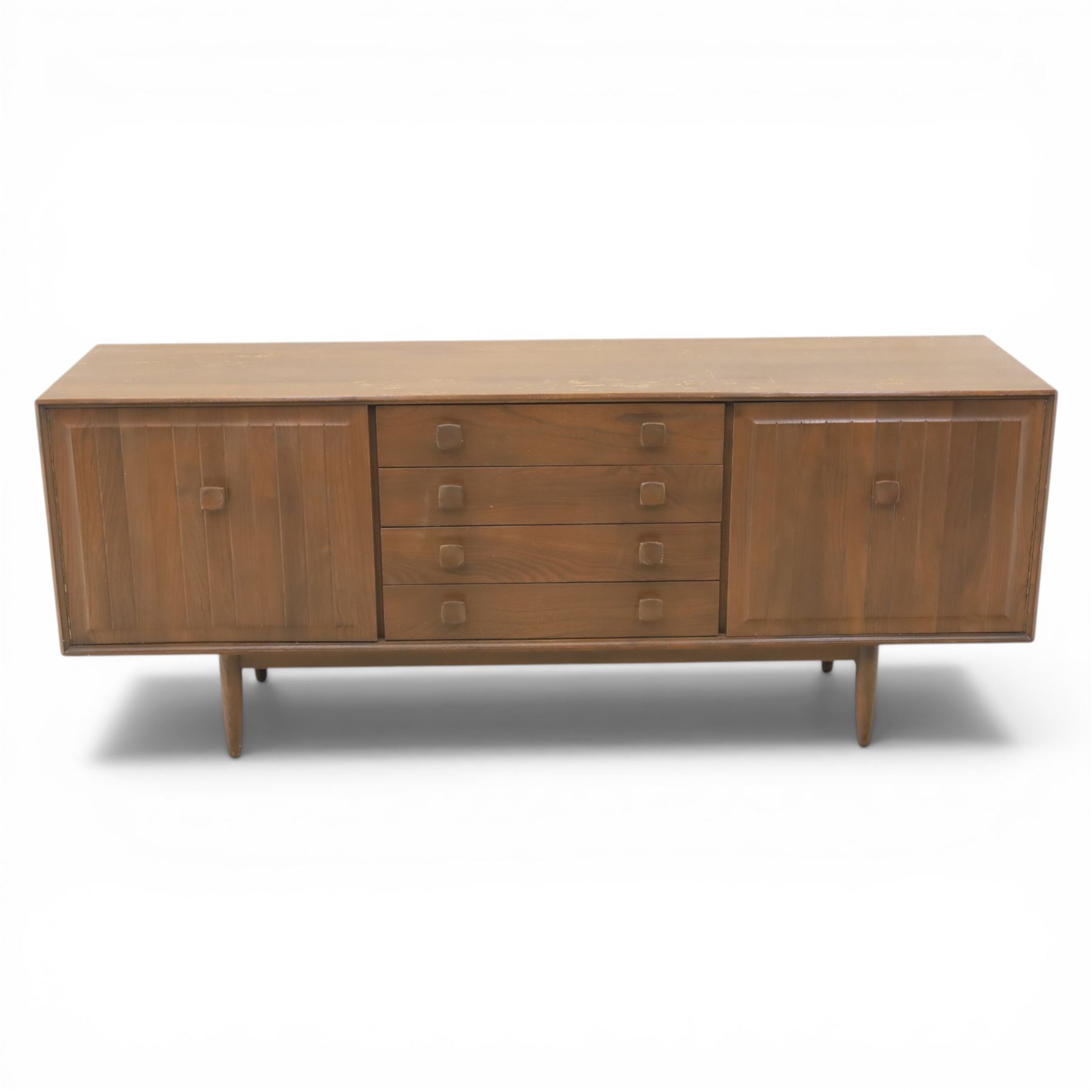 Ensign - Mid-20th century elm sideboard, with a central bank of four drawers, flanked by cupboard doors, raised on tapering supports, labelled Ensign Bristow & Townsend Ltd