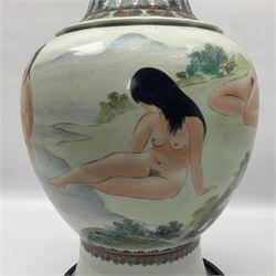 Chinese famille verte vase, of baluster form with fluted rim, the body decorated with five nude female figures amongst water and trees, with bands of polychrome foliate and floral decoration to base and rim, with six character Qianlong mark beneath, upon a circular wooden base, H41.5cm