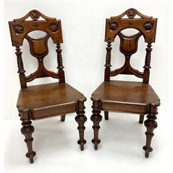 Pair 19th century oak hall chairs, carved and pierced backs, solid seat, turned tapering supports