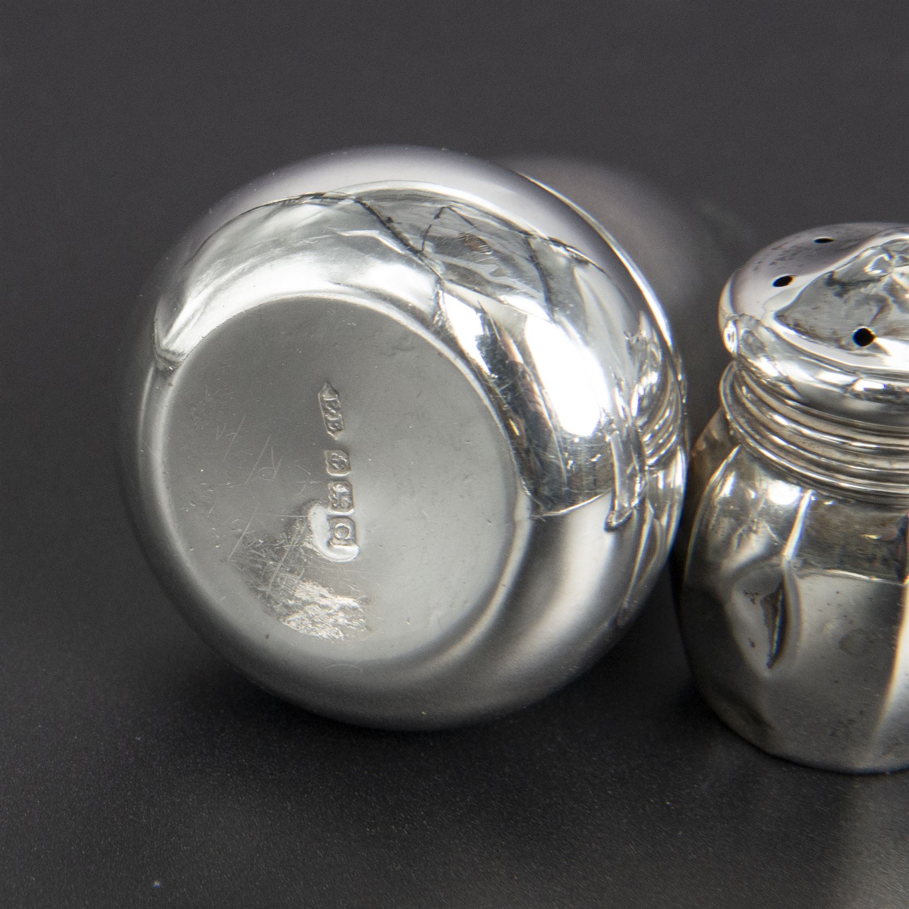 Group of silver cruets, including a pair of Edwardian conical shaped salt and pepper shakers and four other salt/pepper shakers, all hallmarked 