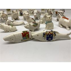 Collection of figural crested ware, to include Carlton Chins John Bull Alnwick, Clifton China Cheshire Cat,  Arcadia pig, Crafton crawling baby and another seated baby, quantity of cat, dog and pig figures, two Willow Art Model of Bunyans Statue, Toby jug, Victoria China, Arcadan bulldog, fish etc