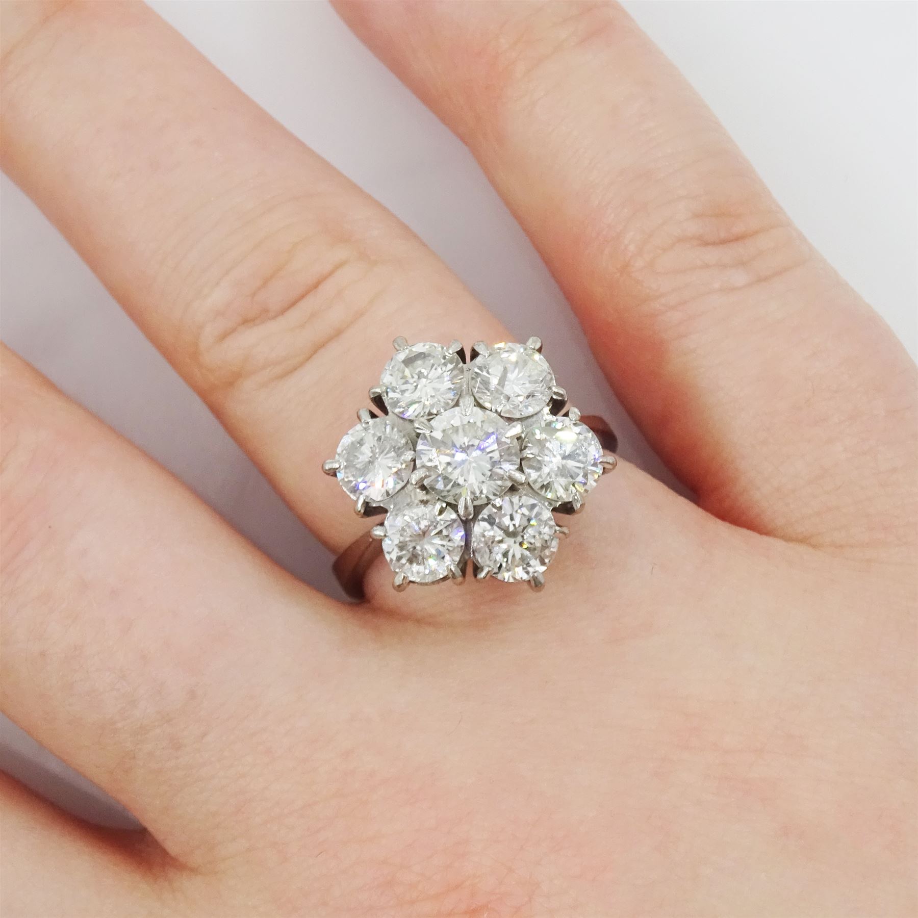 18ct white gold seven stone round brilliant cut diamond flower head cluster ring, London 1977, principal diamond approx 0.75, total diamond weight approx 3.15 carat