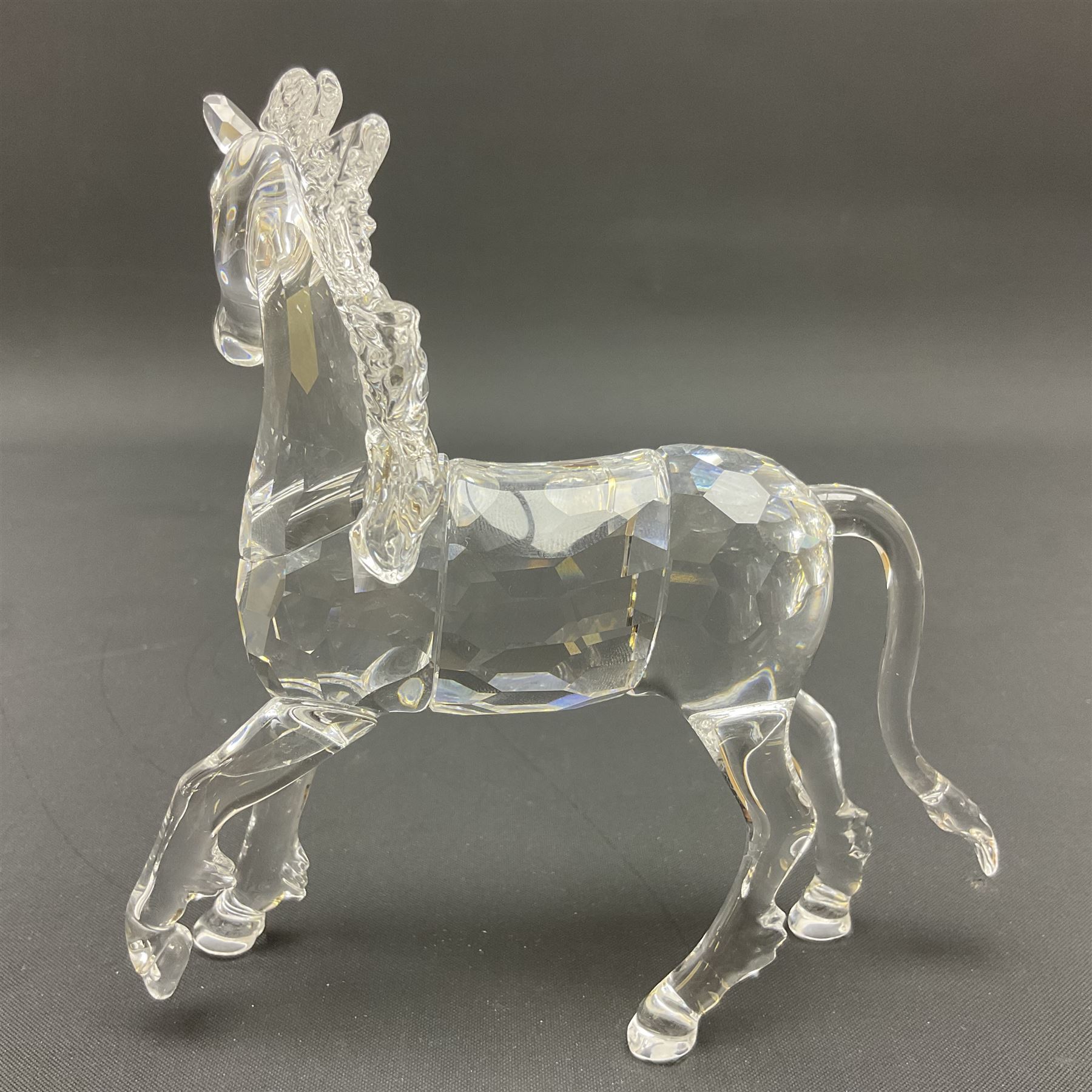 Swarovski Crystal animals, comprising white peacock, the tail with cascading blue flowers, perched eagle with yellow beak, ibex with frosted crystal horns and unicorn with frosted crystal horn, tallest H13cm