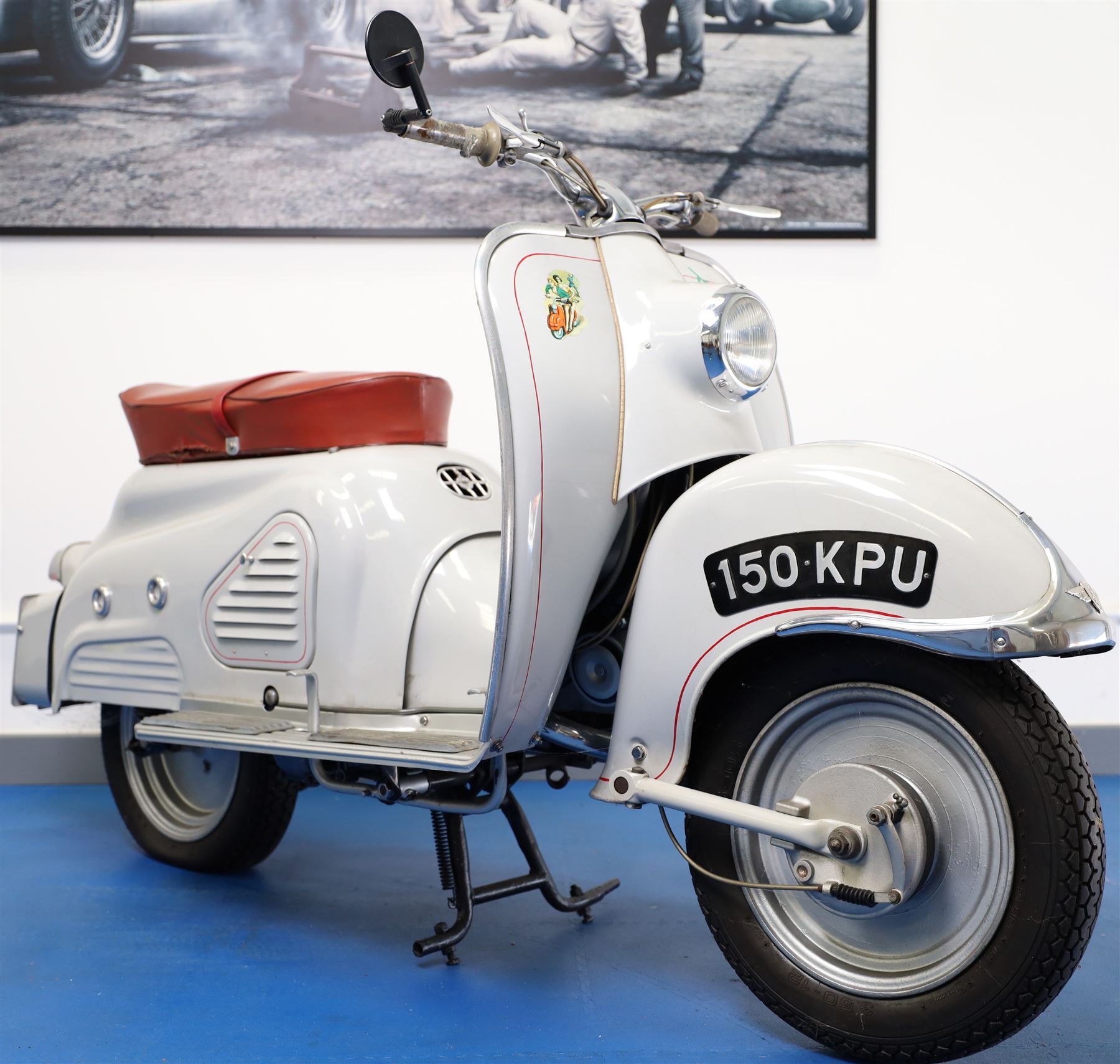 1957 Zündapp Bella R154 Scooter

• Registration: 150 KPU
• Year: 1957
• Model: Bella R154
• Engine: 150cc two-stroke single-cylinder petrol
• Transmission: Four-speed manual
• Odometer reading: 1,727 miles
• Colour: Ivory
• Seating: Dual seat
• V5C: Present
• Original registration book: Present
• Keys: 1

A characterful 1957 Zündapp Bella R154 scooter, finished in ivory with a contrasting brown dual seat and displaying an odometer reading of 1,727 miles.

The Bella R154 formed part of Zündapp’s distinctive range of German touring scooters, combining a 150cc air-cooled two-stroke engine with four-speed transmission, large wheels and substantial pressed-steel bodywork. This example retains its enclosed front apron, central headlamp, chrome handlebars, brightwork, period VDO speedometer and decorative Bella badging.

An operation and maintenance manual is include and accompanied by its V5C and original registration book from 1957.

This vehicle forms part of the Estate of the Late John Sills and is offered for sale by the Executors, confirming a genuine reason for sale.