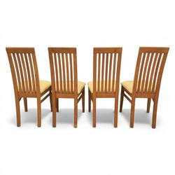 Contemporary teak dining suite comprising extending table and eight chairs, the table with rectangular plank top and one additional leaf extending to 210cm, supported on square tapering legs, the chairs with tall slatted backs and cream upholstered seats