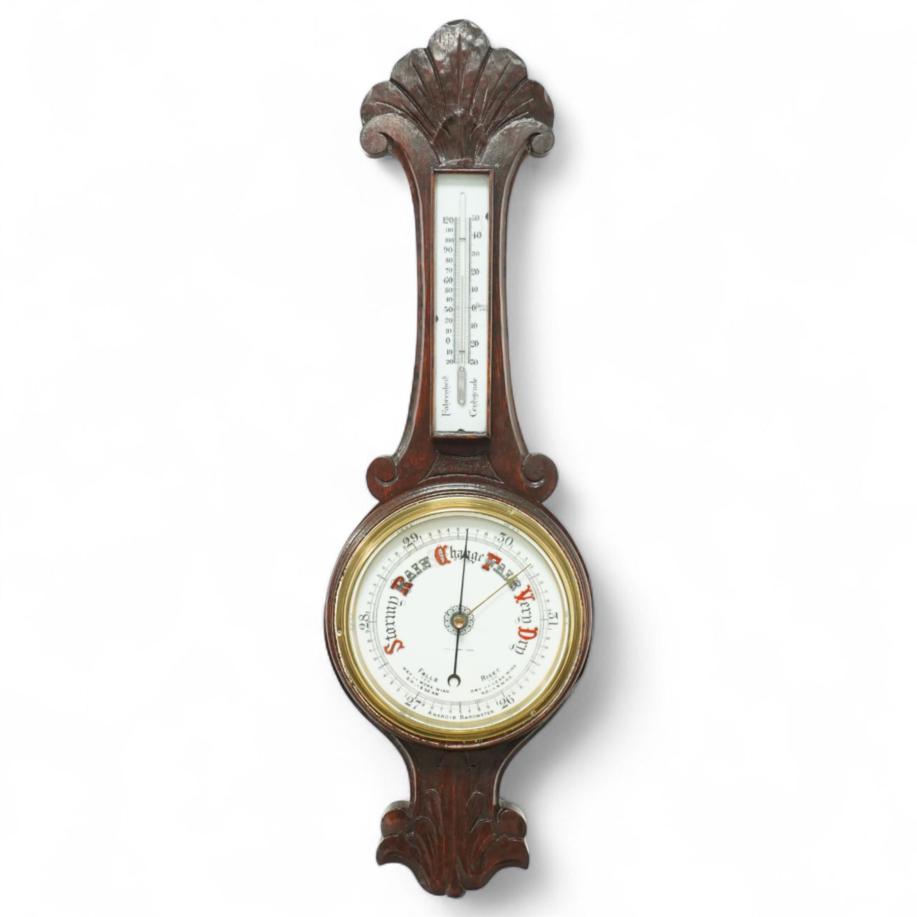 Early 20th-century aneroid barometer with an 8-inch ceramic dial, signed Negretti & Zambra, in a carved oak case, featuring a mercury thermometer