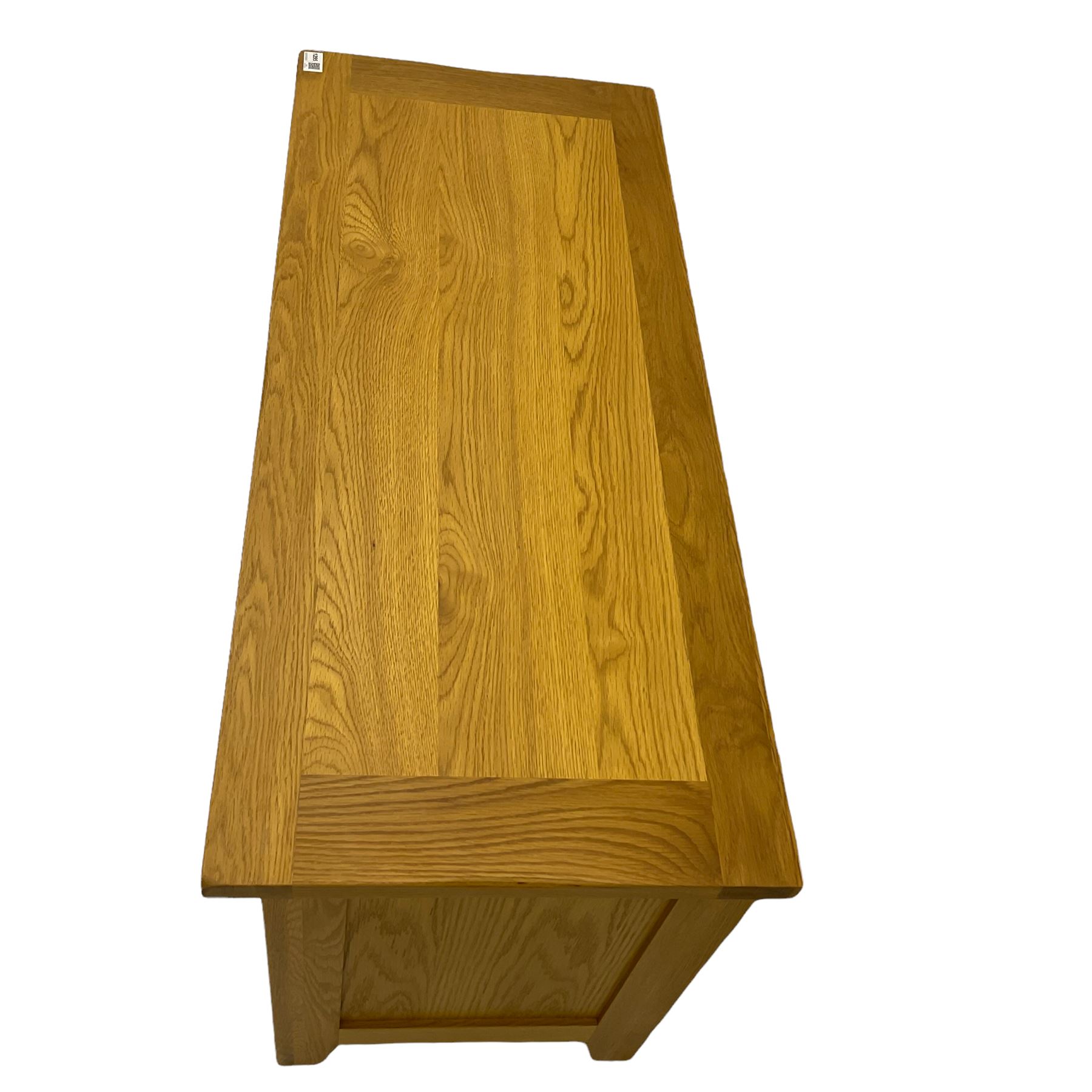 Solid light oak television stand, fitted with shelf and cupboard The