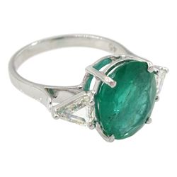 18ct white gold three stone oval emerald and trilliant cut diamond ring, stamped K18, emerald approx 3.90 carat, total diamond weight approx 0.60 carat