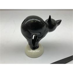 Three Czechoslovakian graduated frosted glass figures of seated bull-dogs tallest H7cm; and Goebel figure of a startled black cat with removable long wooden tail (4)