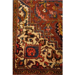  Persian Meshed carpet, large central stylised medallion on red field, decorated with flowers and foliage, 265cm x 286cm  
