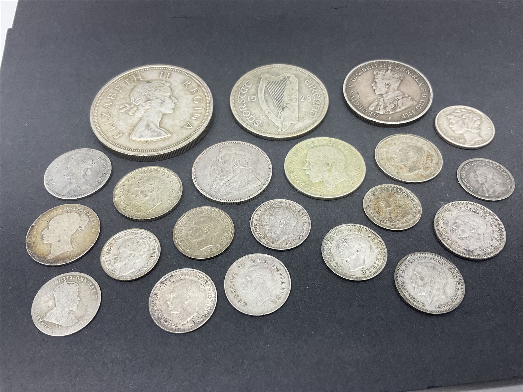 Queen Victoria India 1894 quarter rupee, South Africa 1895 one shilling coin, King George V Australia 1911 one florin - two shillings, Ireland 1928 two shillings sixpence, United States of America 1943 Liberty dime, Queen Elizabeth II South Africa 1957 five shillings and other coinage