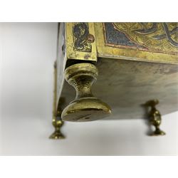 Late 19th century Damascus Cairoware Quran box, of square form with canted hinged cover, upon four circular pad feet, the brass exterior inlaid with silver and copper script and decorative detail, opening to reveal a marquetry lined interior, H15.5cm W19cm D19cm