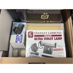 Stamps, postcards, accessories and related items, including Guernsey mint stamps and miniature sheets, ultra violet lamp, Guernsey philatelic news etc, in four boxes 