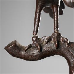 Japanese late Meiji period bronze koro and cover, surmounted by an eagle finial and with bird decoration in high relief to each side, twin elephant trunk handles, bearing indistinct character signature to one side, H82cm