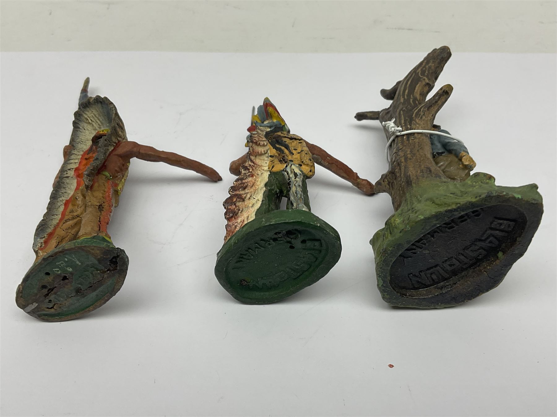 Five Elastolin American Indian figures, together with an Elastolin campfire and a cowboy tied to a tree, tallest H11cm