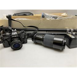 Minolta X-700 camera and lenses comprising Skylight 55mm lens and 135mm lens, Auto 280PX flash, together with other accessories to include tripod etc
