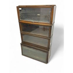 Globe Wernicke - early 20th century oak four-tier stacking library bookcase, four glazed sections enclosed by hinged and sliding doors