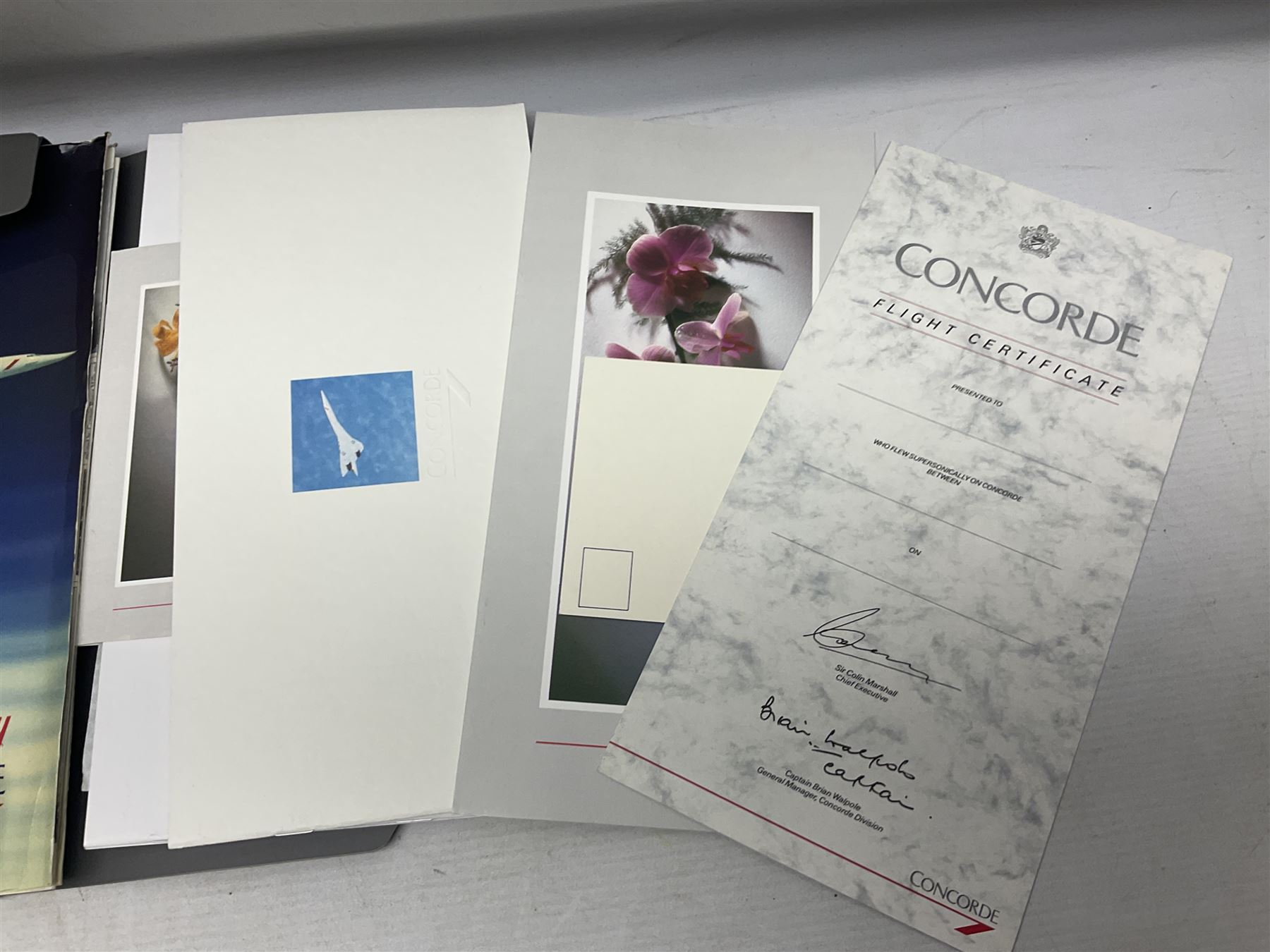 Queen Elizabeth II Gibraltar 2019 'The Concorde 50th Anniversary Gold Sovereign Prestige Set', comprising full, half and quarter sovereigns, cased with certificate, together with various items of Concorde memorabilia including cased binoculars, flight certificate for Heathrow to Moscow, 'Concorde Through The Lines' photographic tribute book etc