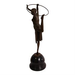 After Demetre Chiparus (1886-1947), an Art Deco style bronze modelled as a dancer with hoop, upon a stepped circular base, H51cm
