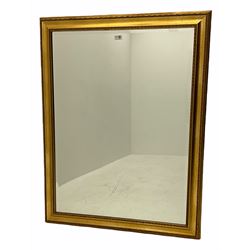 Rectangular bevelled edge wall mirror, in gilt frame