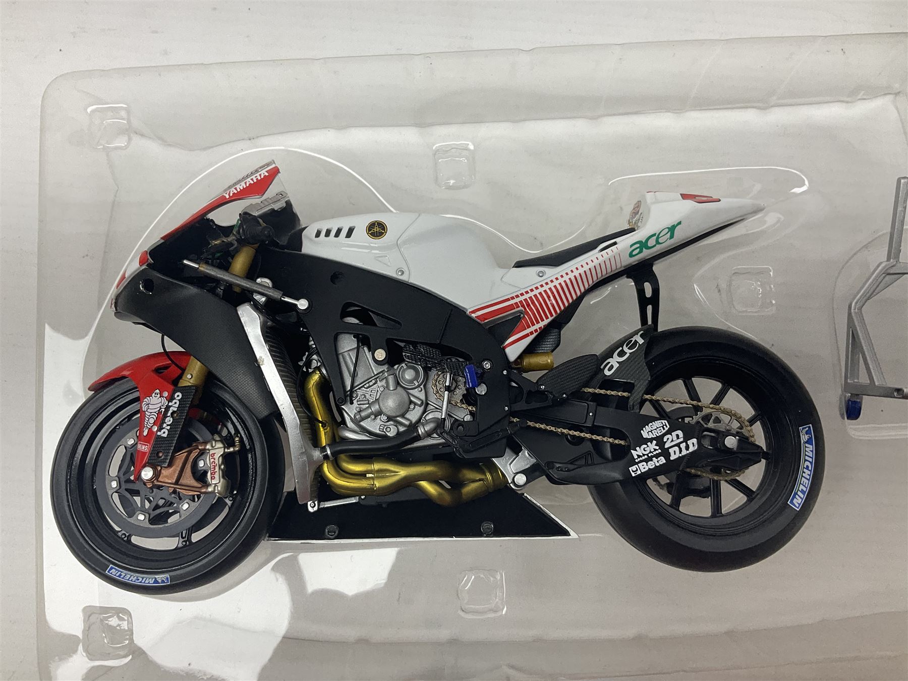 Three Ixo Models 1:12 scale die-cast models of motorcycles - BRB007 Honda NSR500 Michael Doohan 1998; BRB001 Honda RC211V Valentino Rossi 2003; and Yamaha YZR-M1 Colin Edwards MotoGP Phillip Island 2007; all boxed (3)