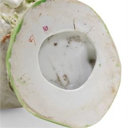 Two 18th century Derby porcelain groups modelled as a ram standing before bocage above a recumbent lamb, upon flower encrusted base, H15cm and two further Derby figures modelled as a ram and cow and calf (3)