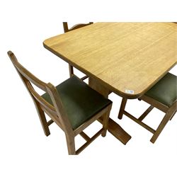 Acornman - adzed oak refectory dining table, rectangular top with rounded corners, shaped end supports joined by pegged stretcher on sledge feet (122cm x 82cm x 74cm), and Acornman - set four oak dining chairs with waved ladder back, upholstered in green, on square chamfered supports (42cm x 42cm x 86cm), by Alan Grainger of Brandsby