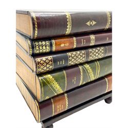 Maitland-Smith - four drawer chest in the form of a stack of leather-bound books, the top drawer with metal label inscribed 'Maitland-Smith', on turned feet