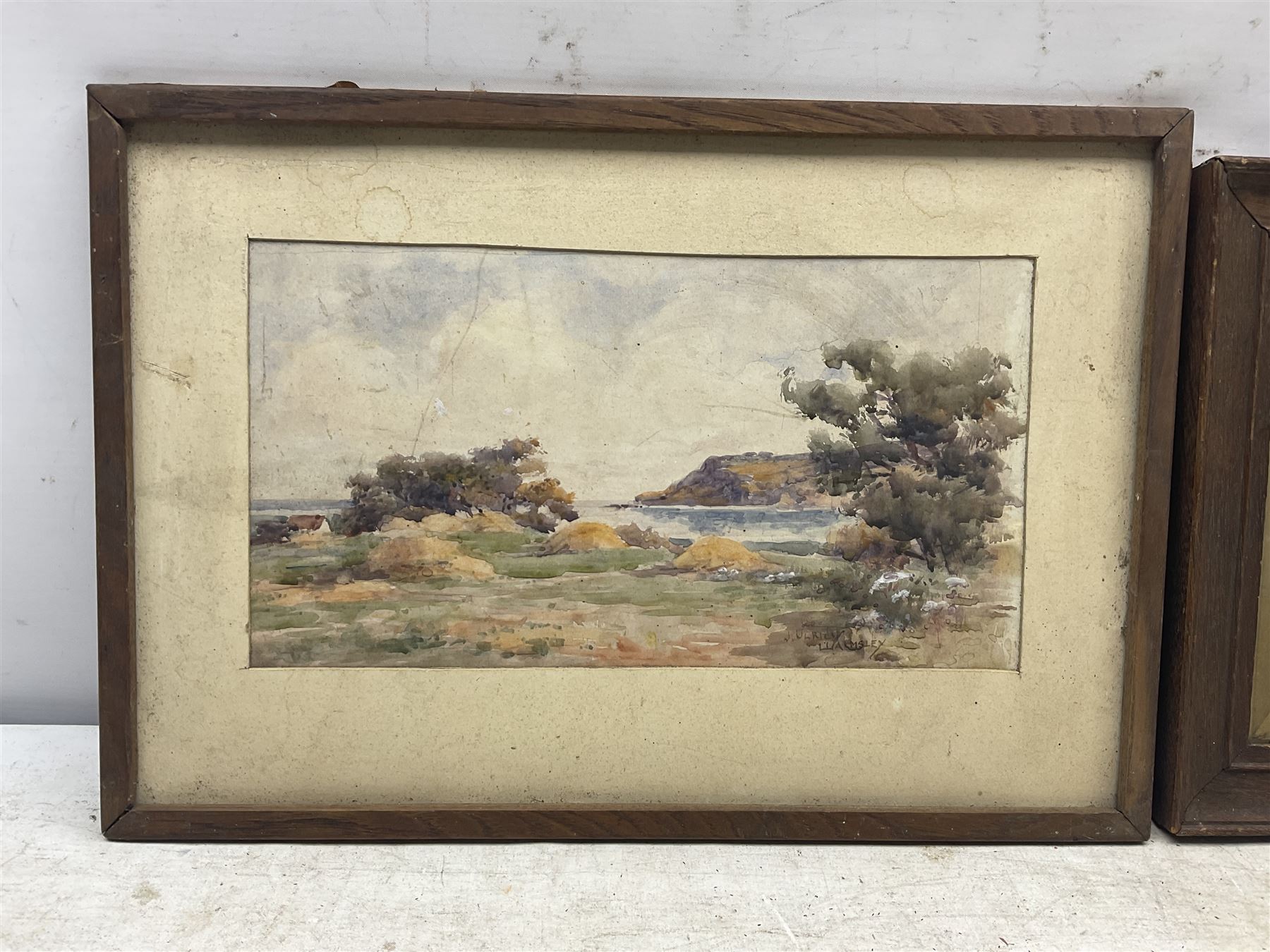 James Ulric Walmsley (British 1860-1954): Ravenscar viewed from Smailes Moor Farm, watercolour signed 16cm x 30cm; Sheila Walmsley (British mid 20th century): Spring Flowers above Robin Hood's Bay, watercolour signed 17cm x 25cm (2) 
Notes: Sheila was James Ulric's daughter.