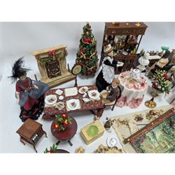 Dolls house living room and dining room furniture, including arm chairs, desk, fireplaces, dressers, tables, eight figures and a large collection of predominantly Christmas themed food, accessories and decorations