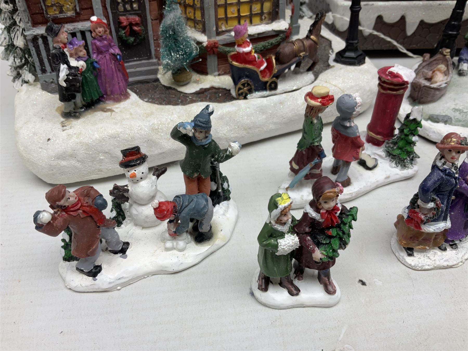 Christmas decorations; Premier LED Christmas Village scene with moving train, together with three Lumineo christmas scenes, and other similar 